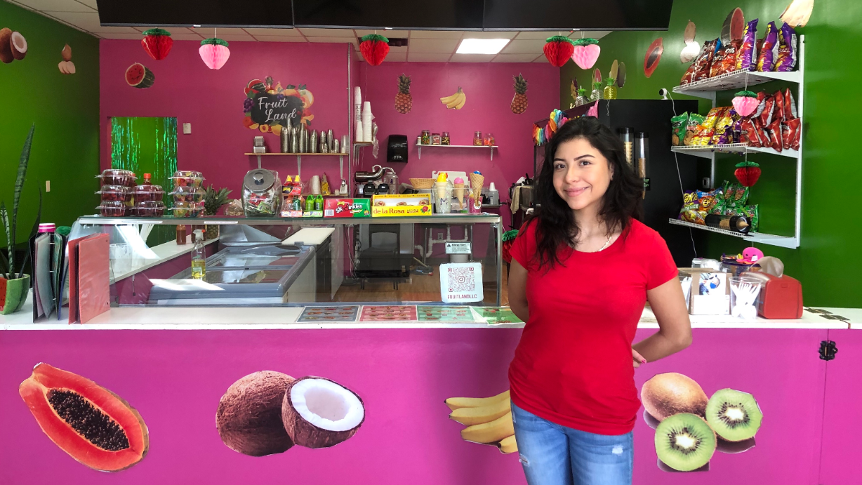 Paloma in front of the counter at Fruit Land