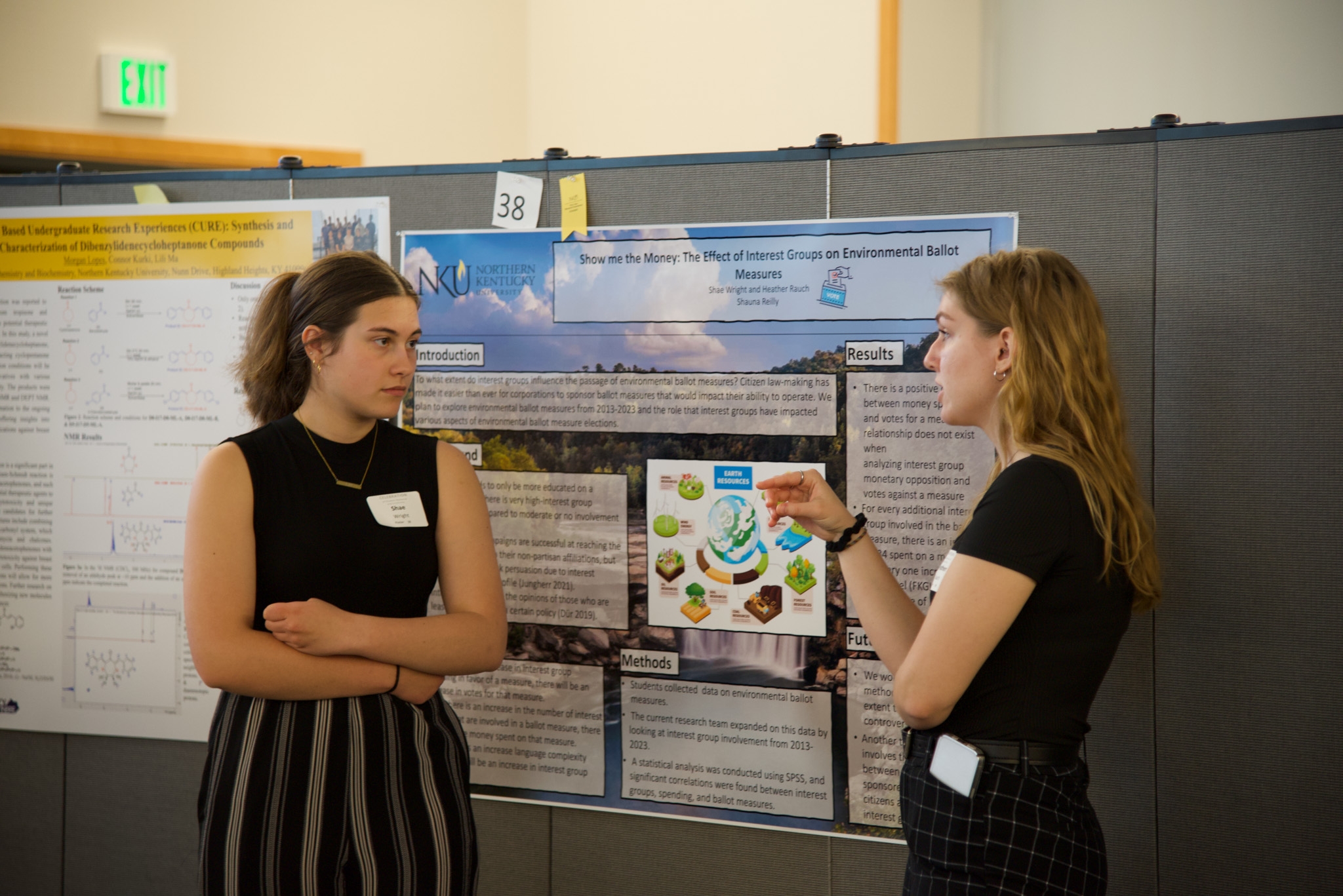 Students discuss their poster project