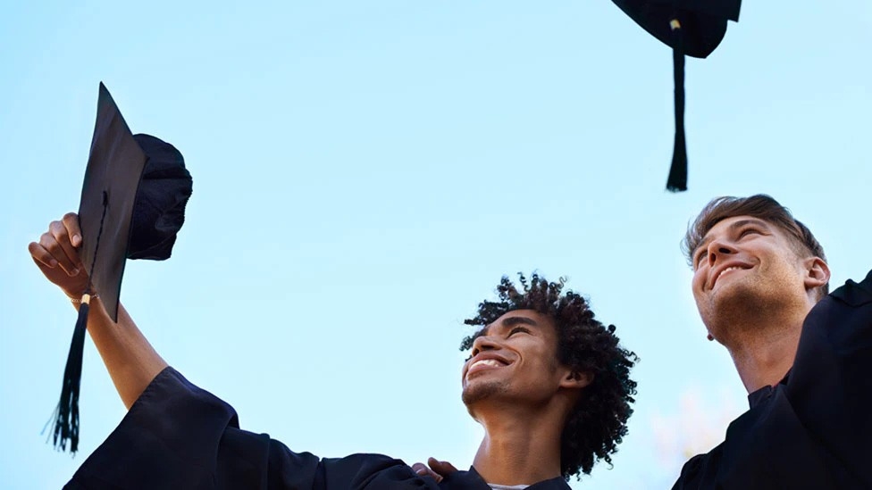 Graduates tossing their caps