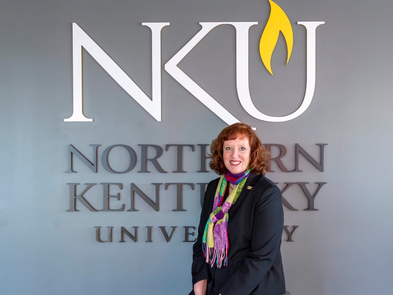 President Cady Short-Thompson in front of NKU sign.
