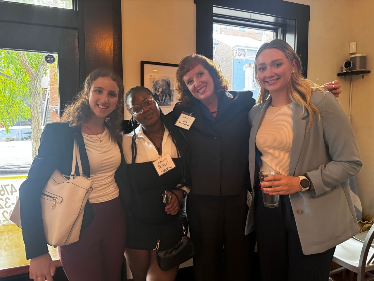 President Cady Short Thompson posing for a photo with three other women