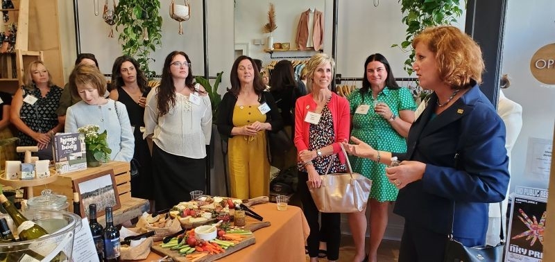 President Cady Short Thompson talking to a group of attendees