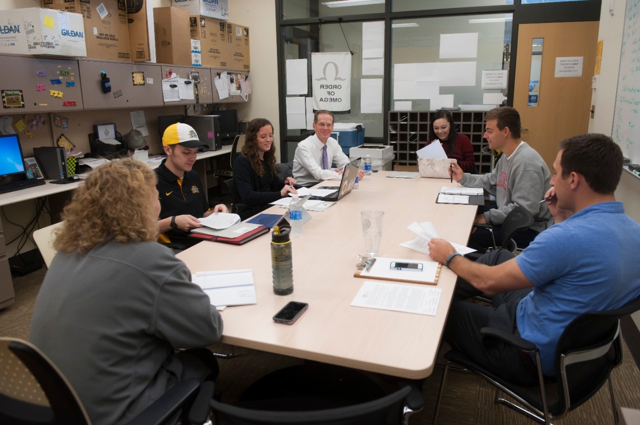 People sitting around a table talking