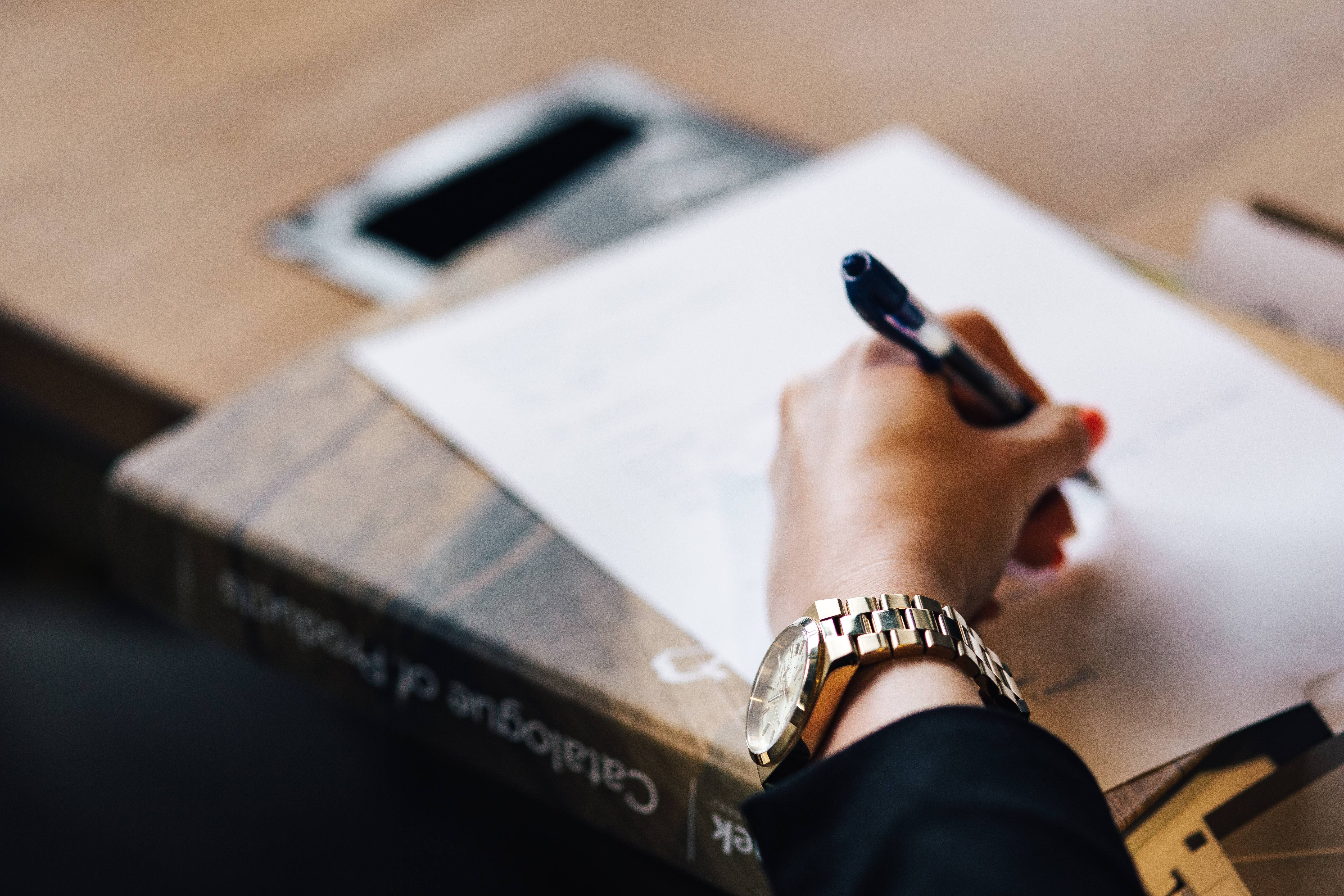 woman taking notes