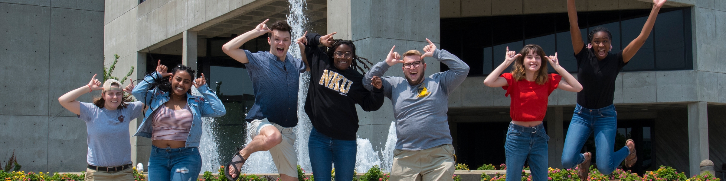 Students doing the "Norse Up" gesture.