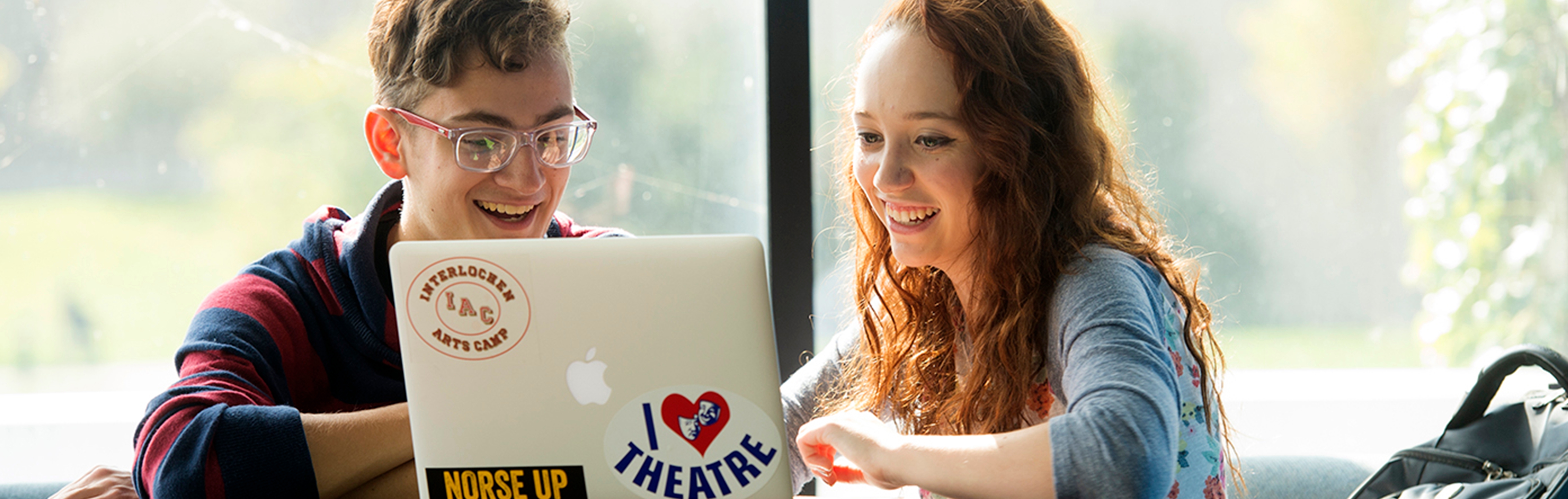 Two students on laptop