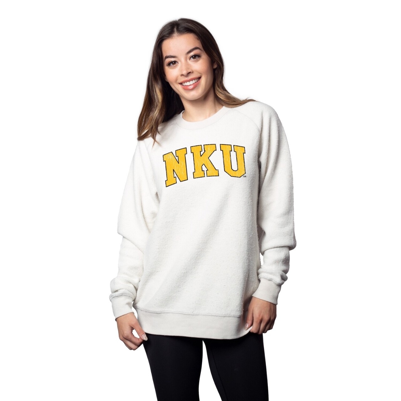 Female student wearing a white Norse sweatershirt with NKU on front