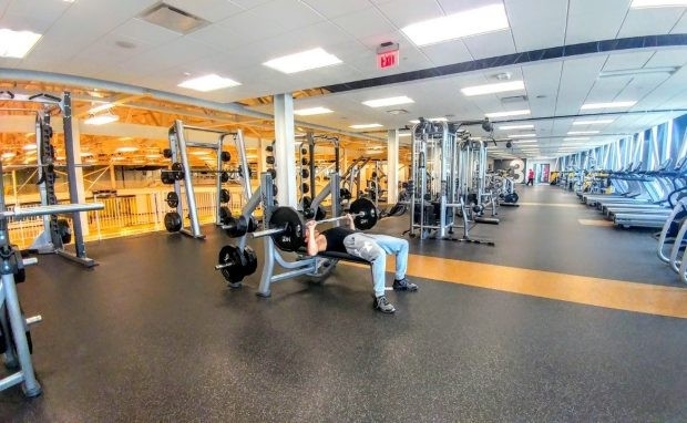 Student lifting weights