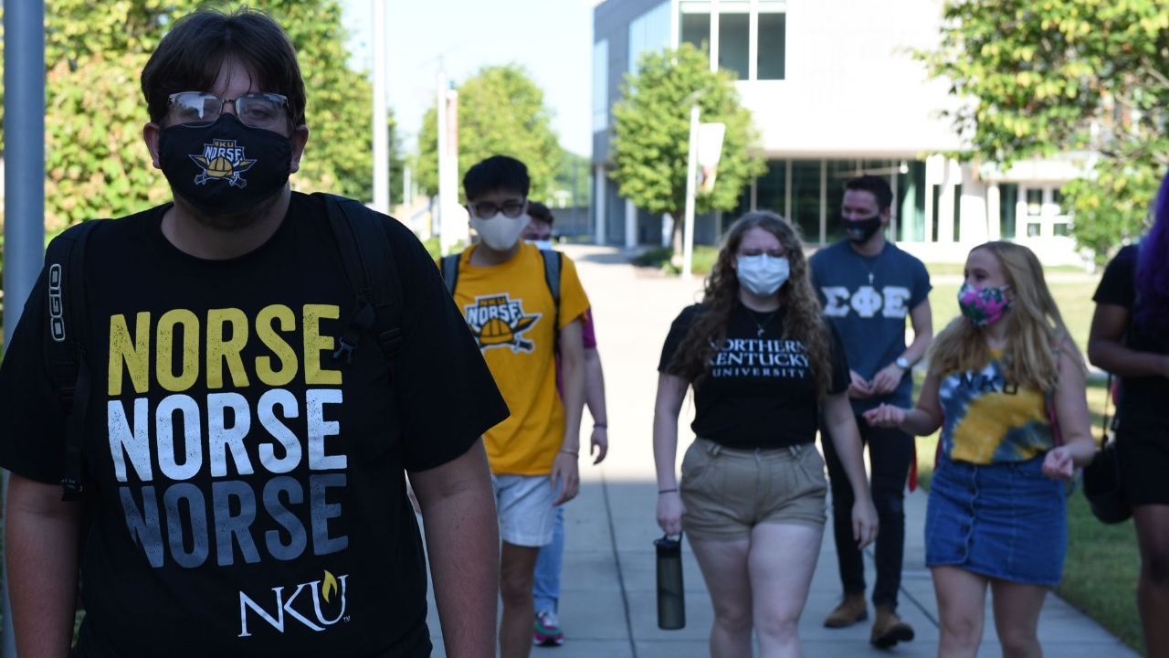 Students on campus wearing masks