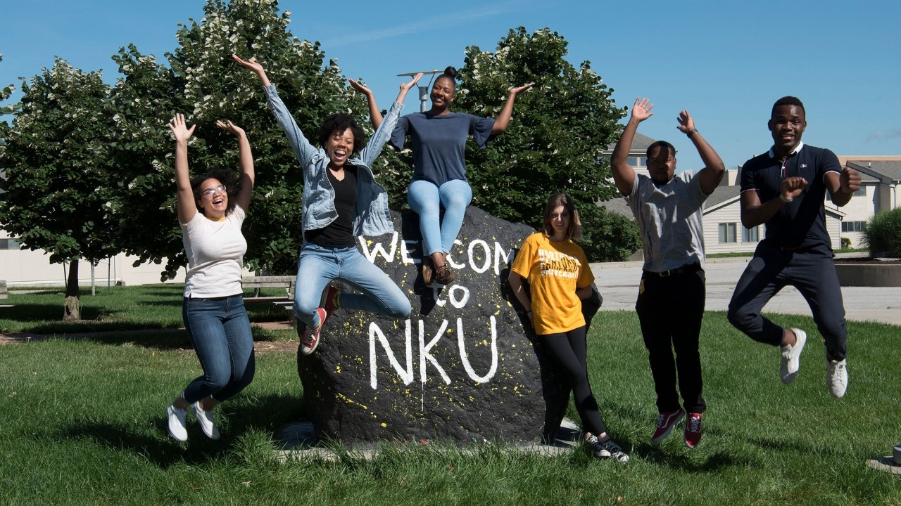 Students jumping near NKU rock