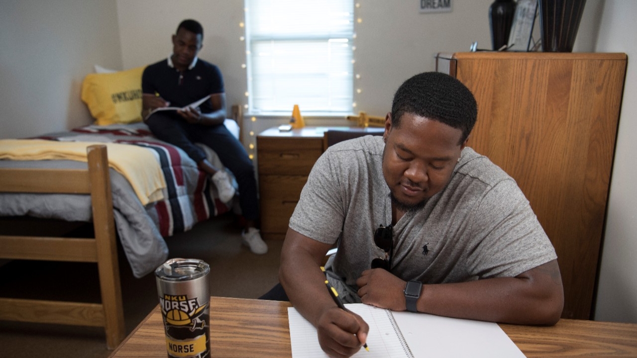 Students studying in dorm room