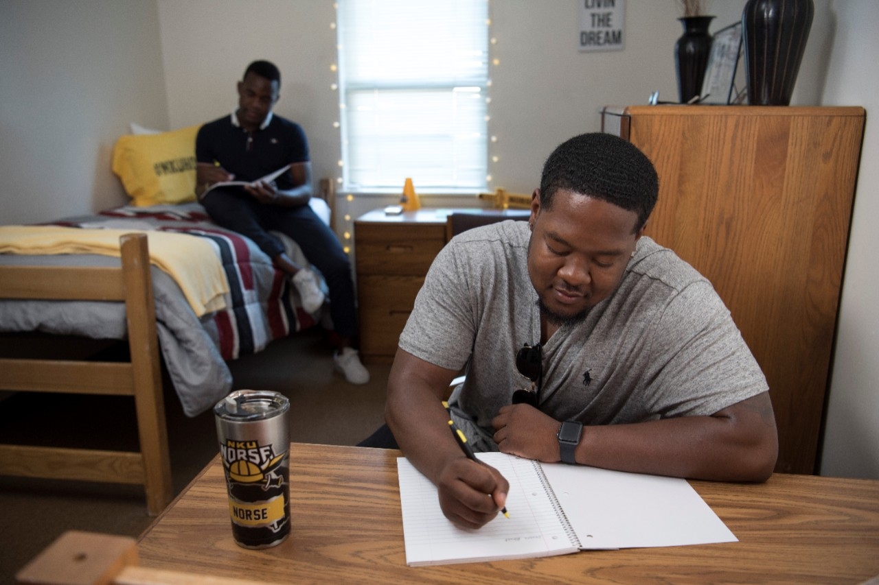 Students studying in dorm room