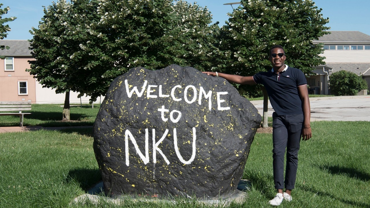NKU Student with rock