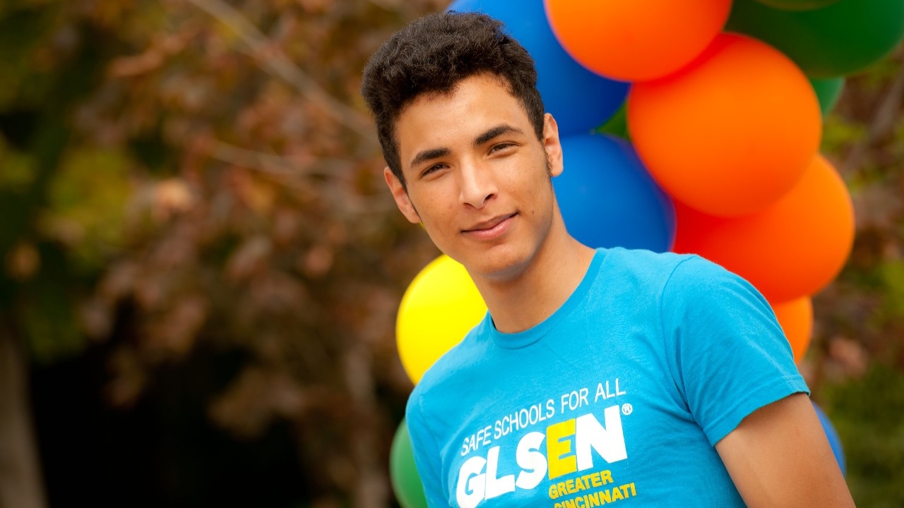 Student in front of balloons