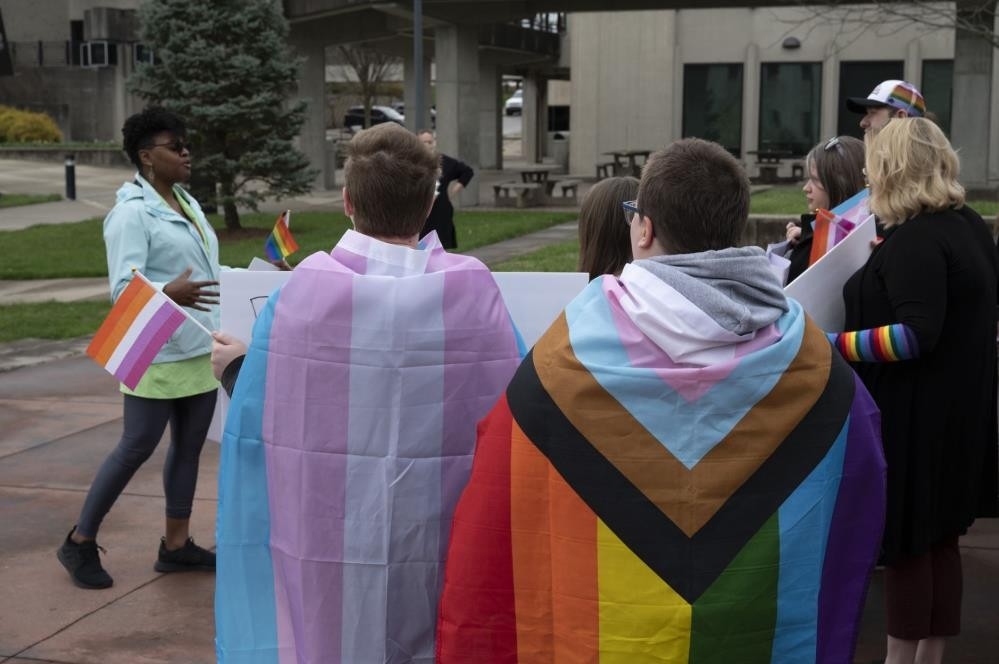 Students wearing colorful flags