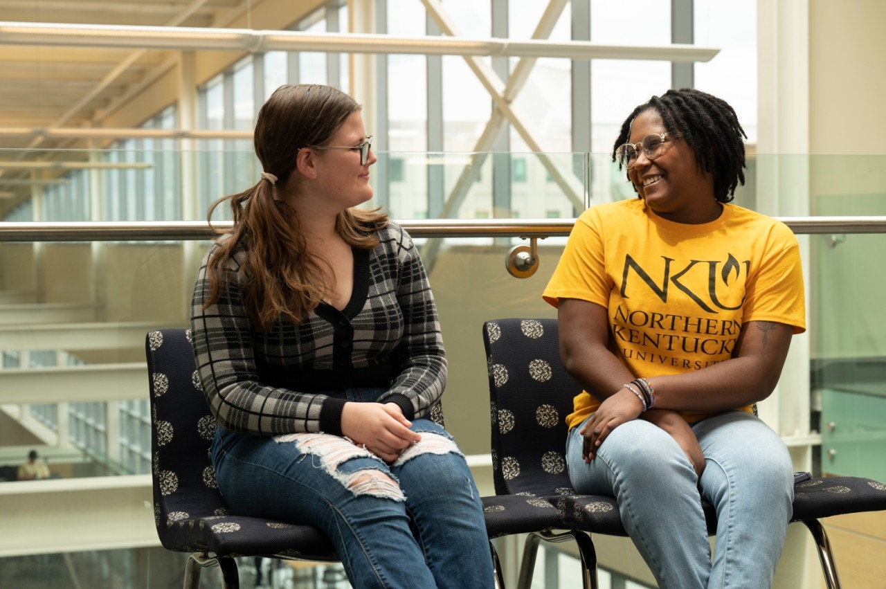Two students sitting next to each other