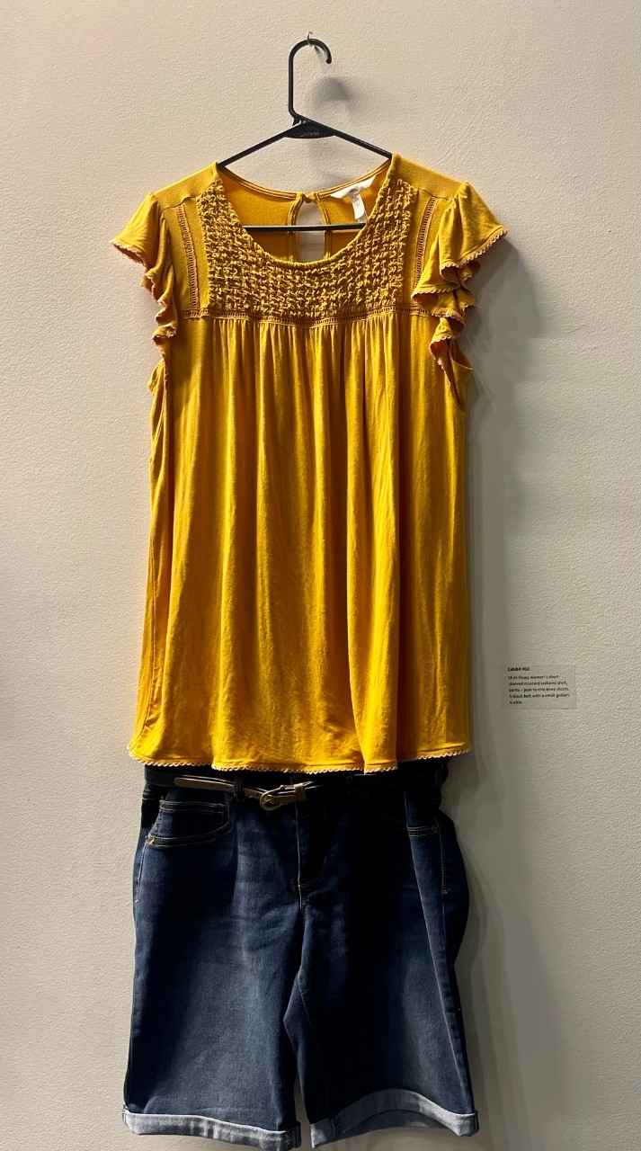 Shirt- flowey women's short sleeved mustard collard shirt Pants- jean to-the-knee shorts A black belt with a small golden buckle