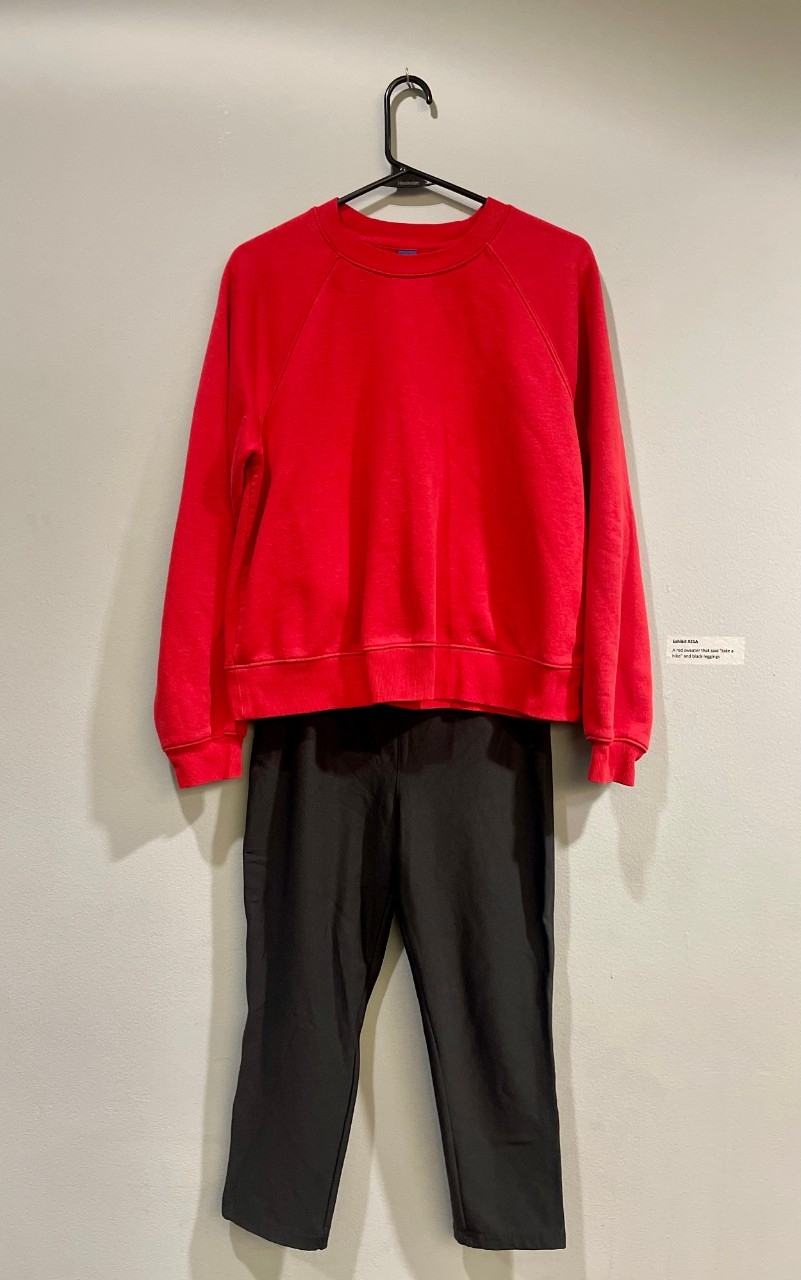 red sweatshirt and black leggings