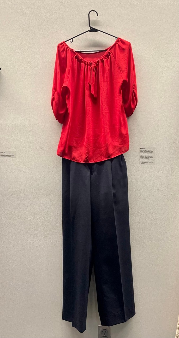 Red loose women's blouse, and black slacks