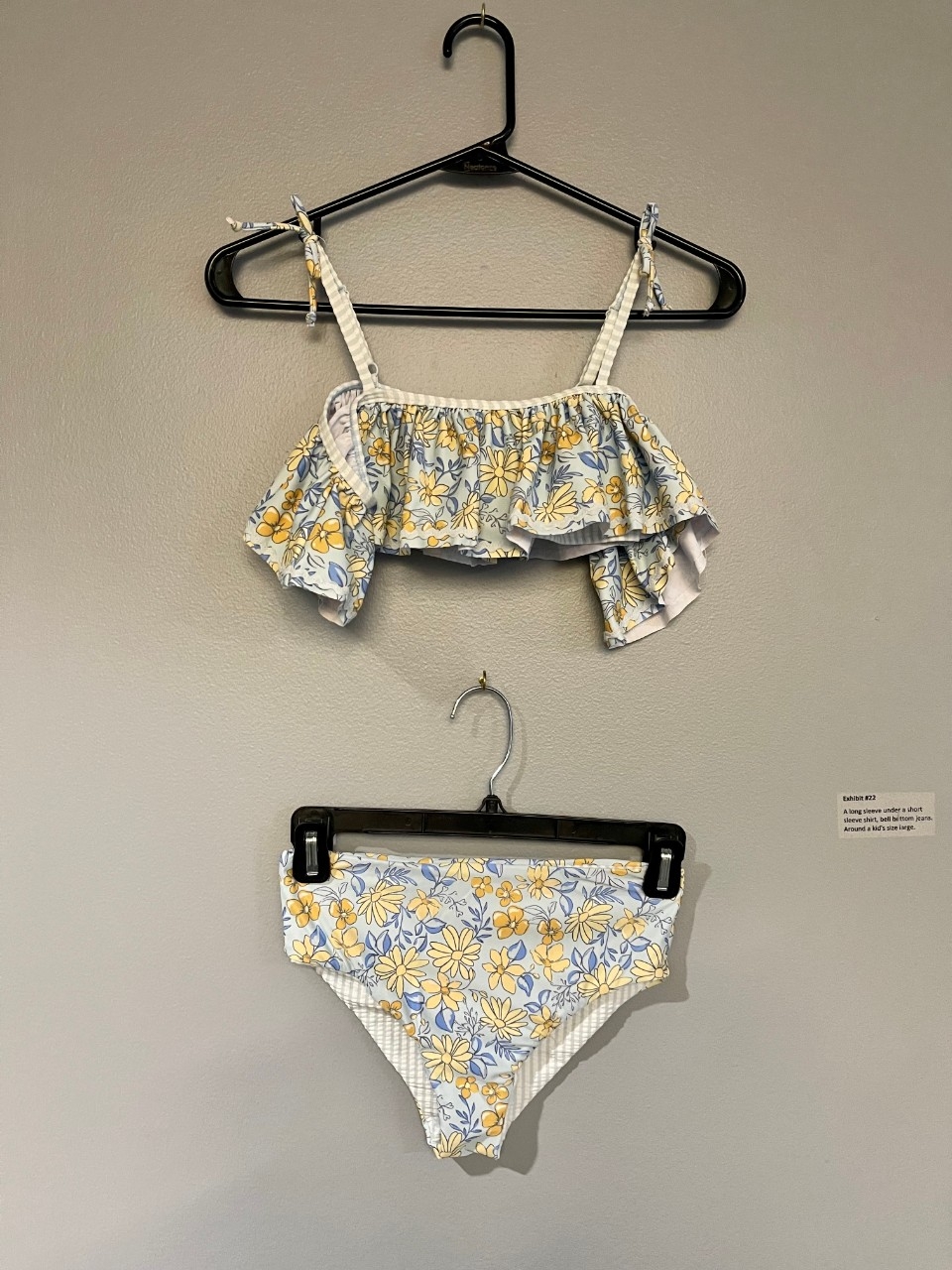 White child's bikini with flowers on it