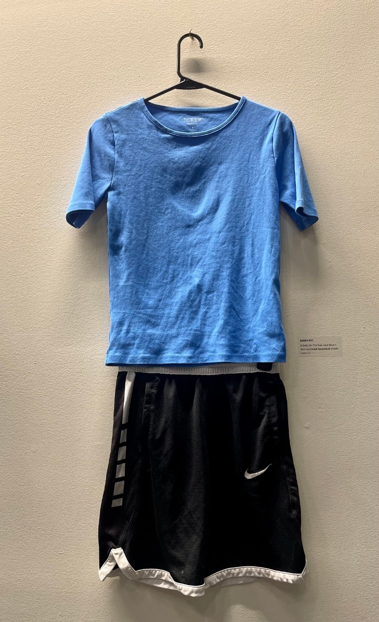 blue tshirt with black basketball shorts