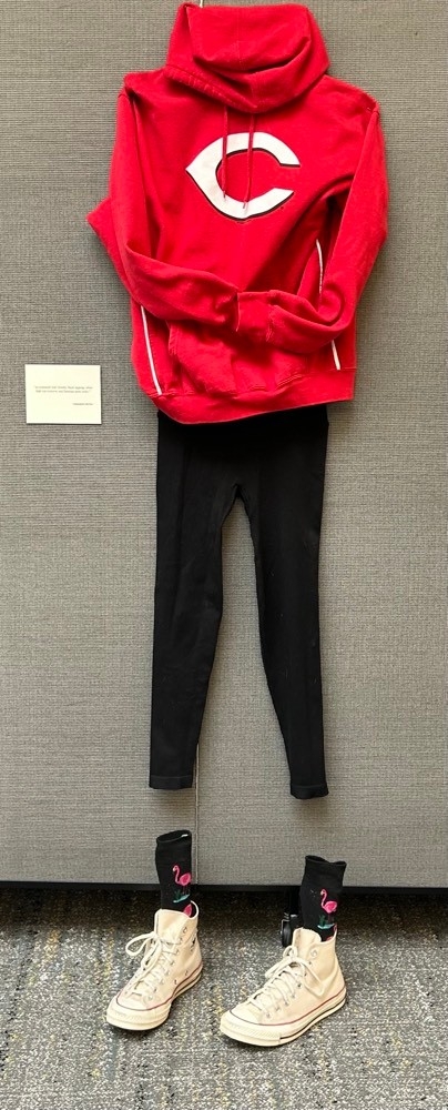 Reds hoodie, black leggings, flamingo socks and white converse