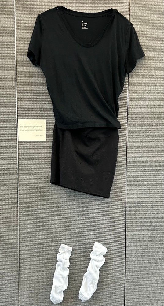 Black shirt with black shorts and white socks