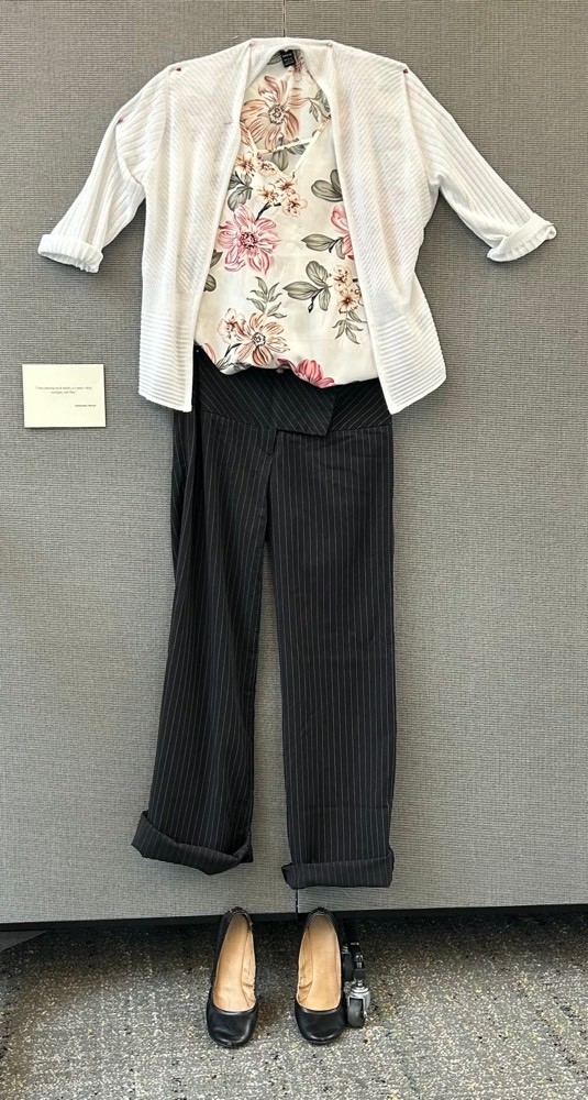 white floral top with white cardigan, black dress pants, and black flats