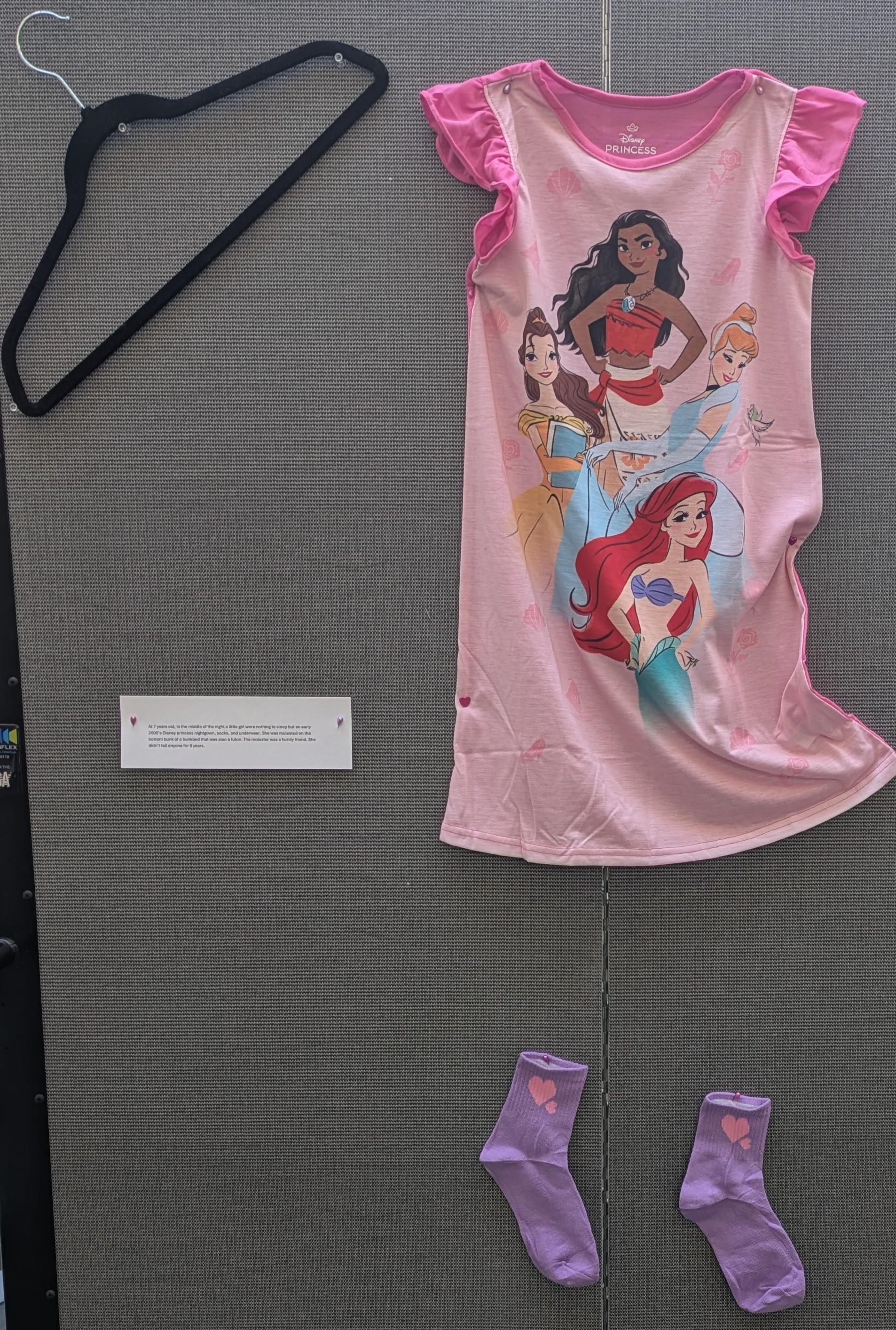 Disney princess nightgown and purple socks.