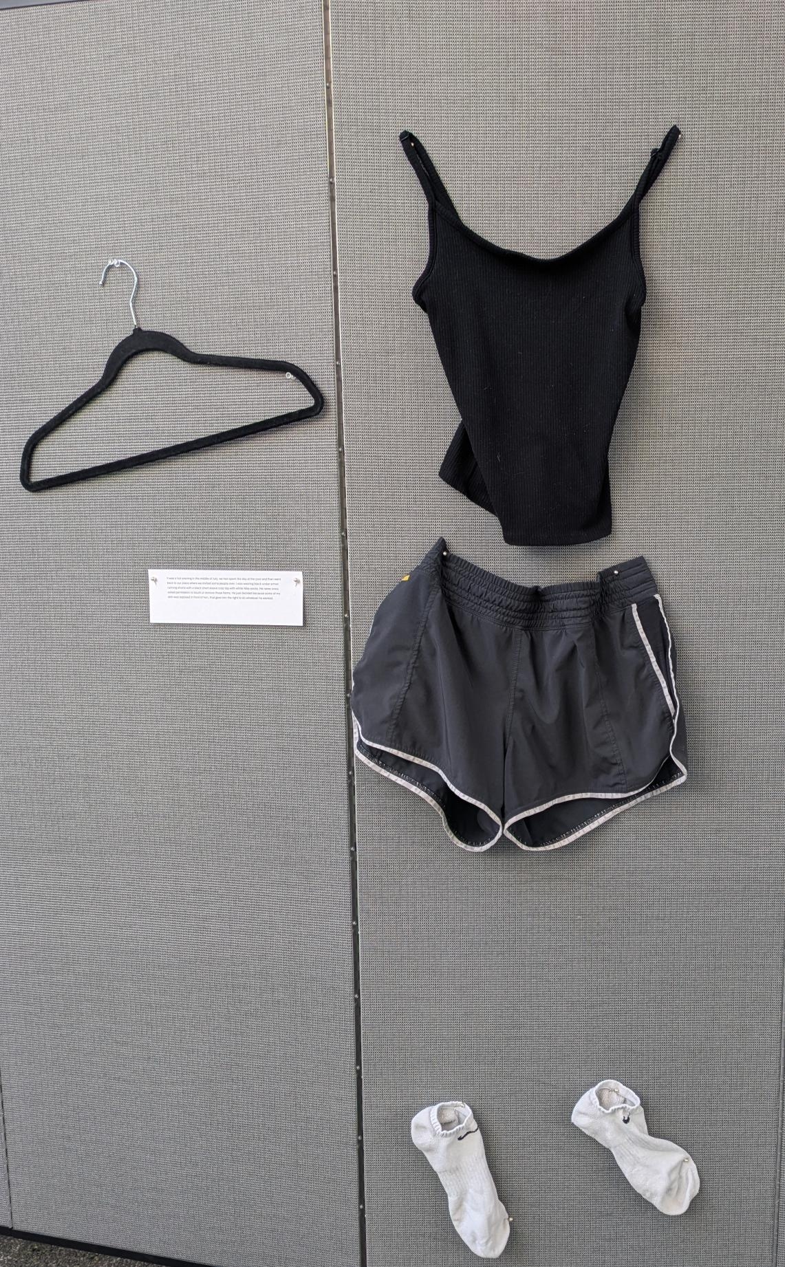 Black tank top with black running shorts and white Nike shorts.