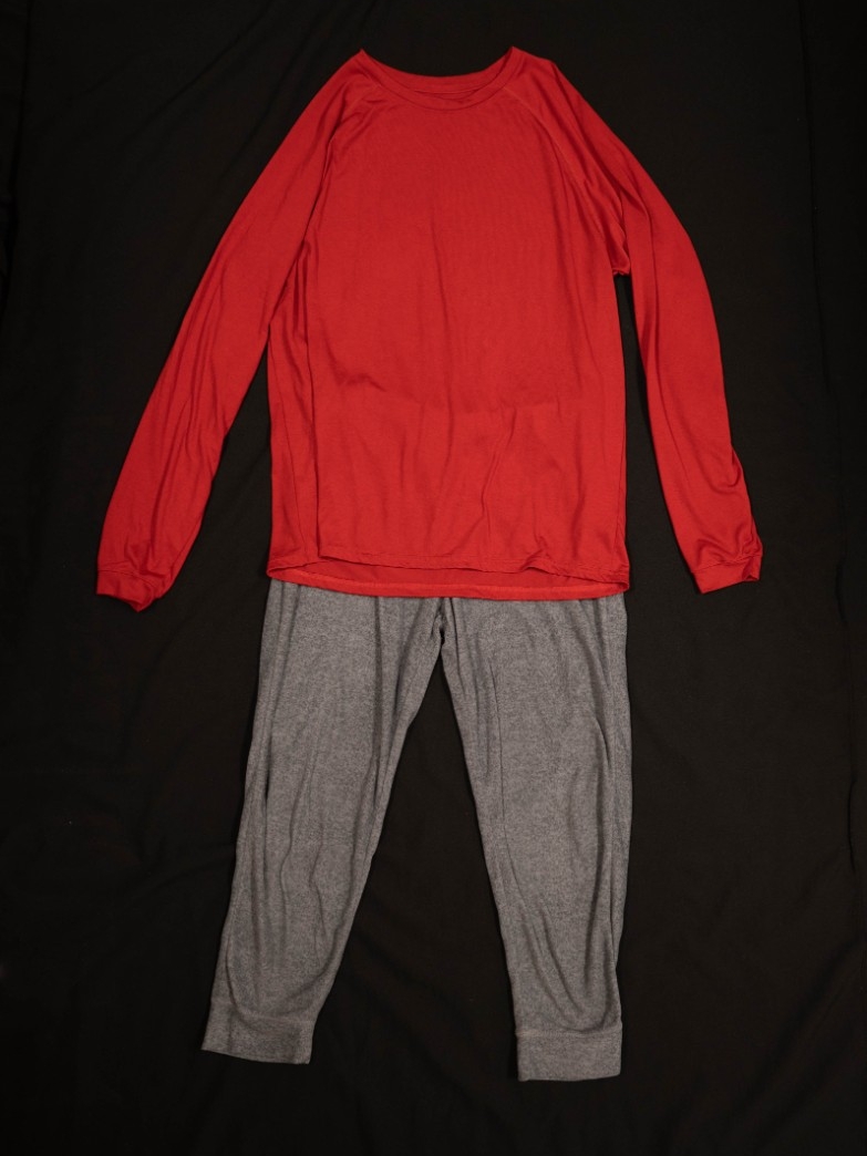 Exhibit displays gray sweatpants and a red oversized long sleeve shirt. 
