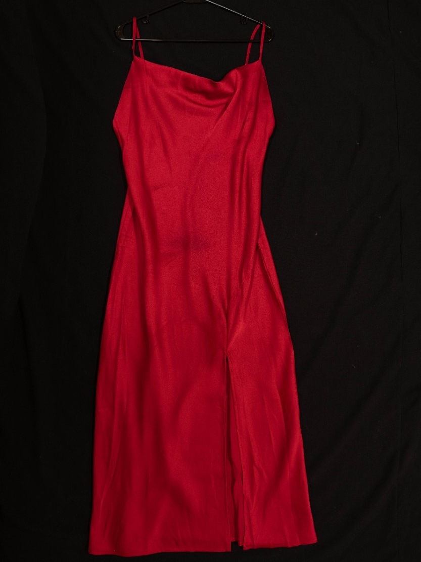Exhibit displays an ankle length, red satin dress.