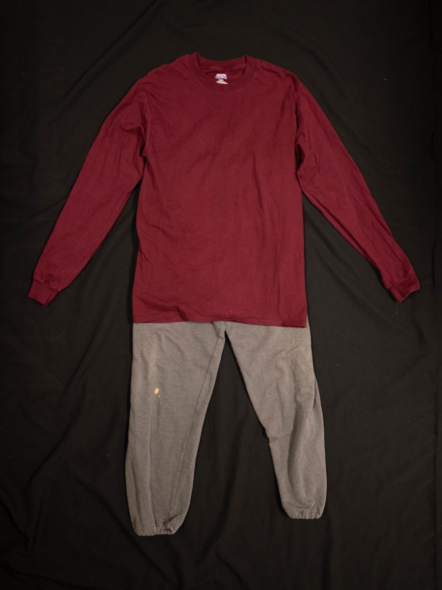 Exhibit displays sweatpants and a maroon, long sleeve shirt.