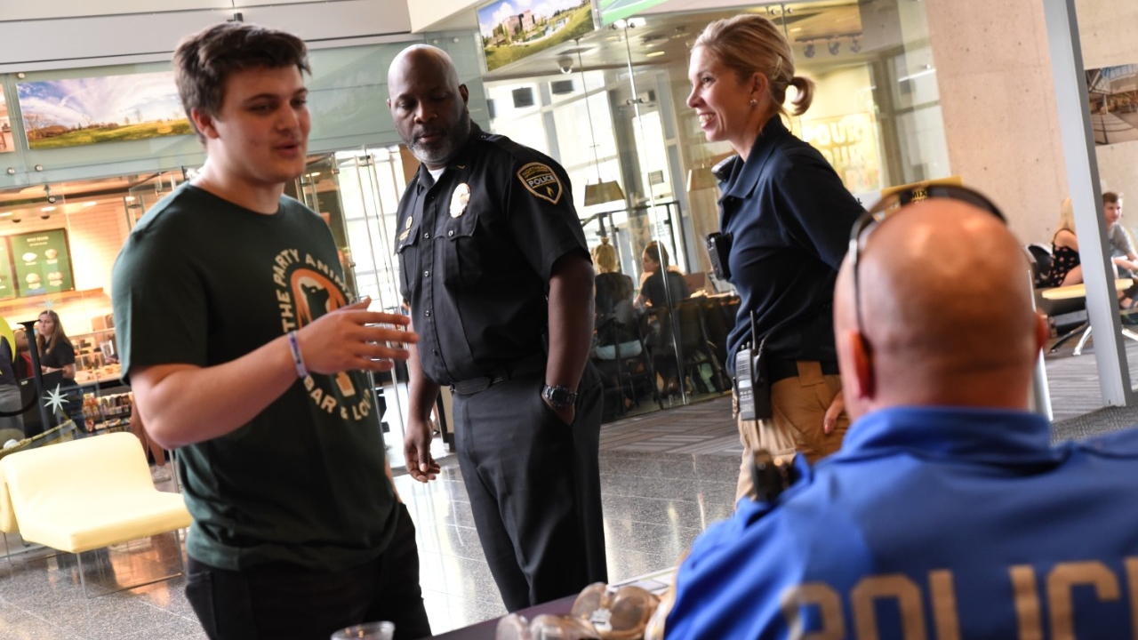 Police interacting with student in Student Union