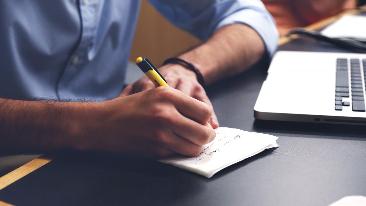 Writing a check on a desk