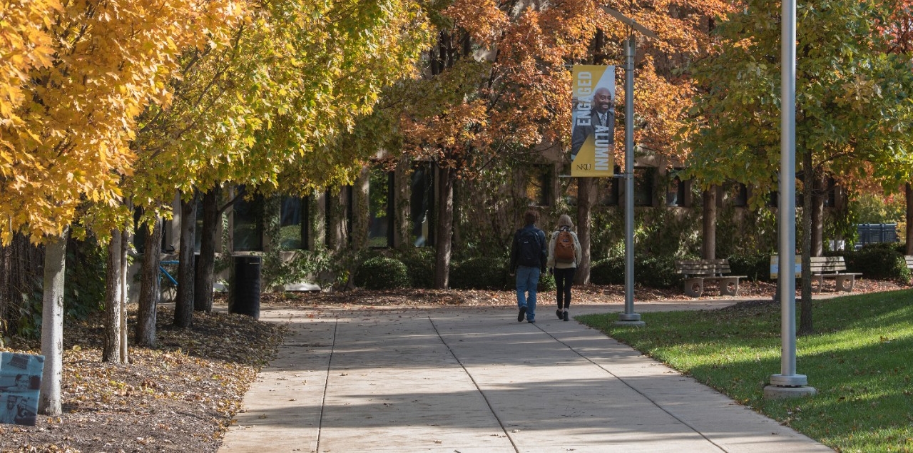 A picture of students at walking in the Fall
