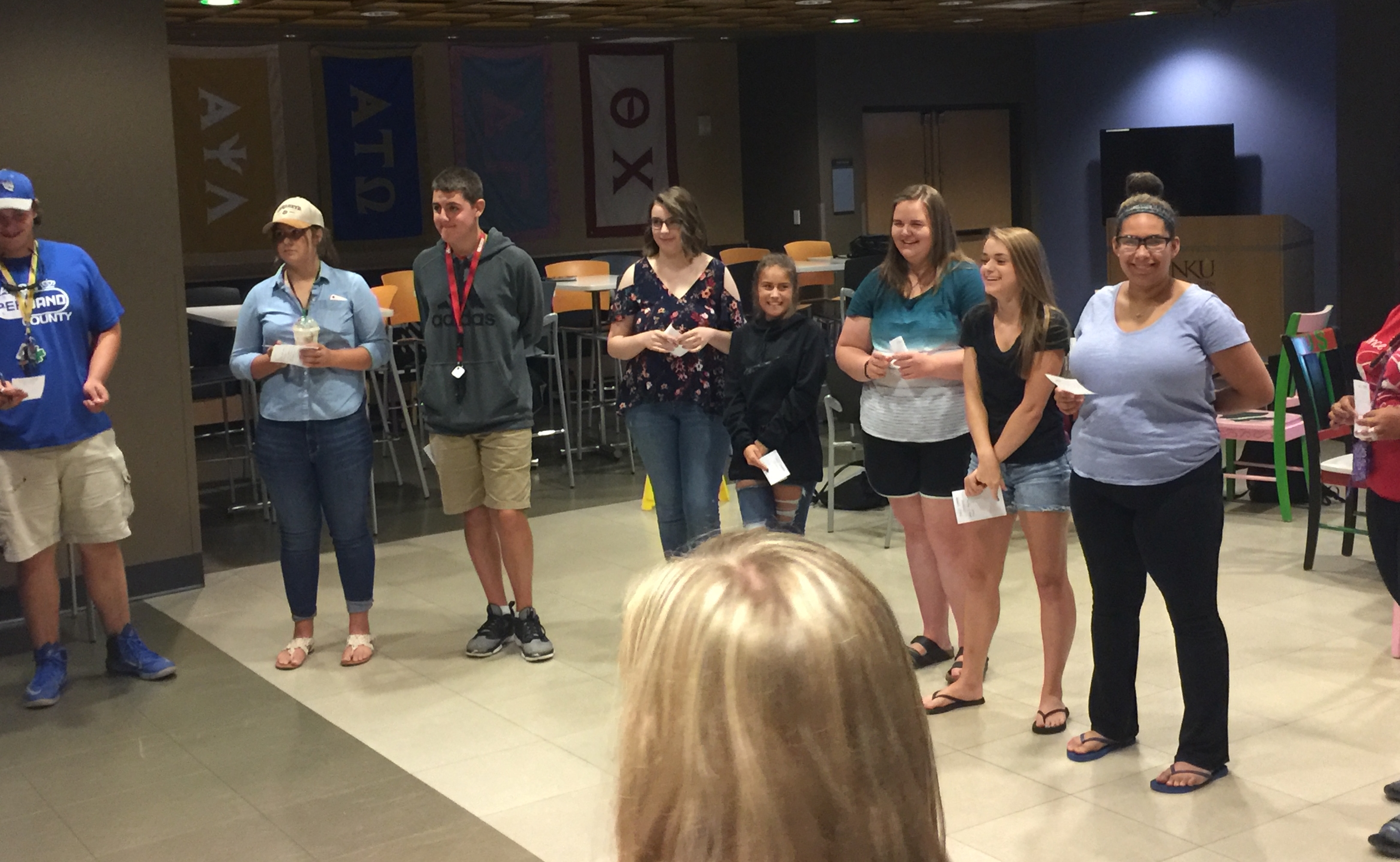 Students standing in a circle