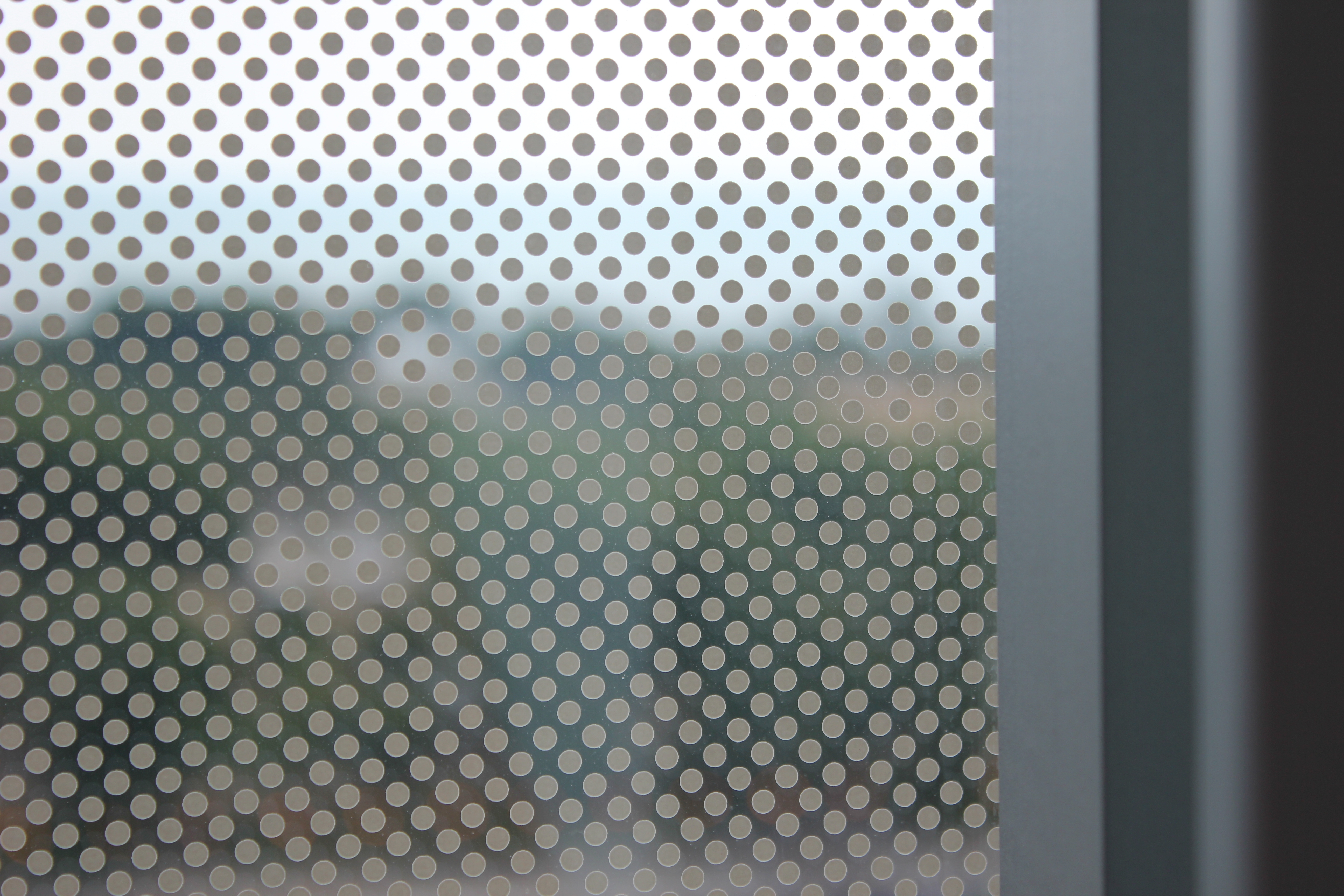 Fritted Glass is pictured with small dots to reduce direct sunlight