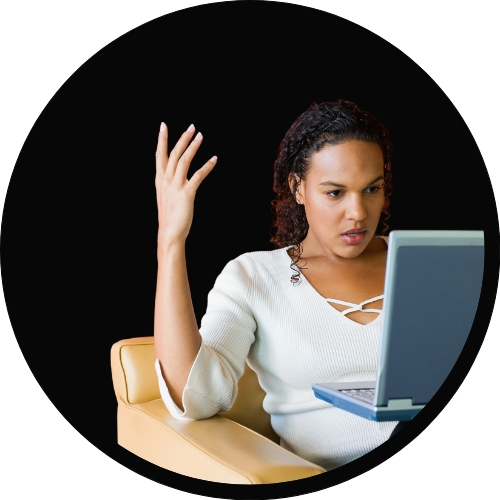 faculty member looking frustrated on a laptop