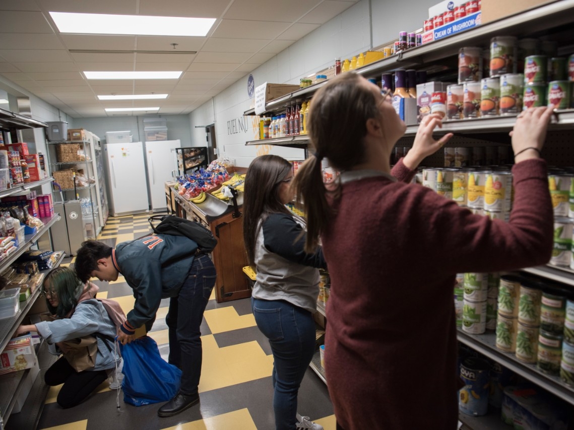 Students volunteering to stock shelves at NKU's food pantry, FUEL NKU.