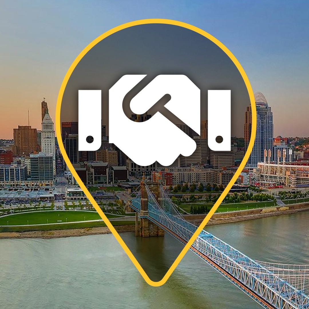 Cincinnati skyline with a handshake icon over top