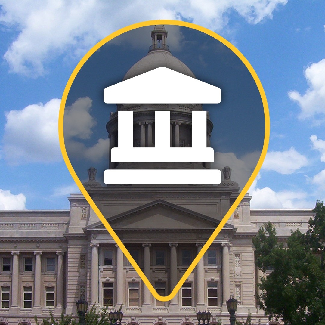 KY capital building in Frankfort with blue sky and a government icon over top