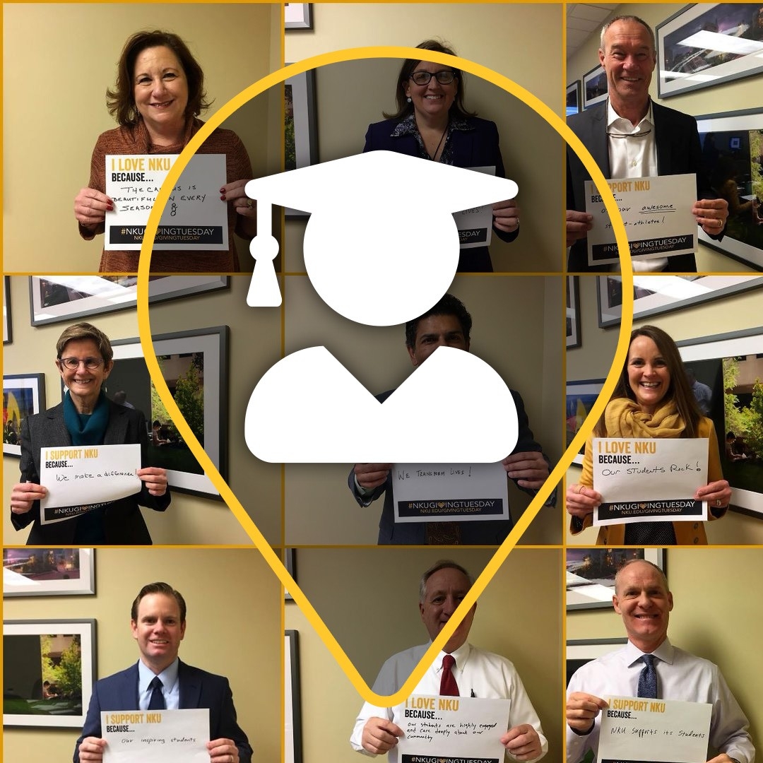 Advancement staff holding up signs for the giving campaign 