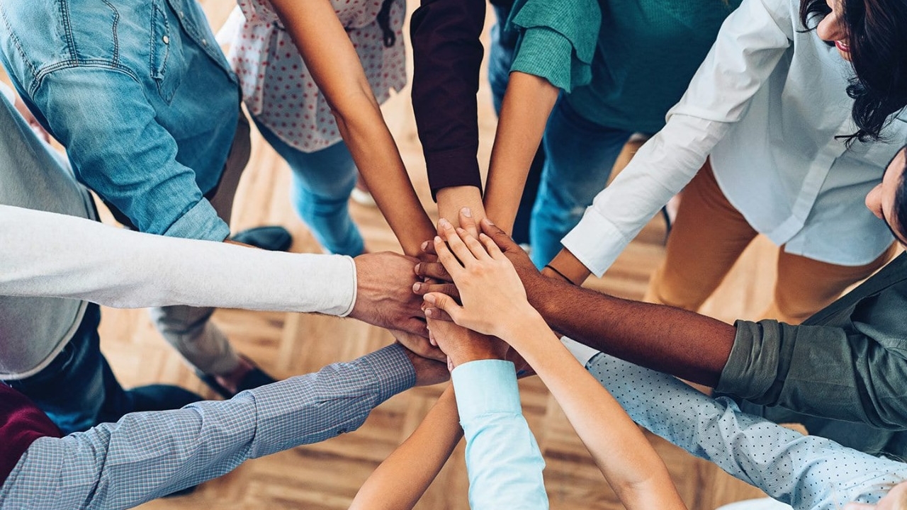 hands coming in together for a team cheer