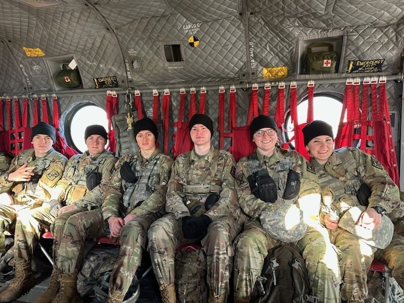 Students working on Mac computer inside a computer lab.
