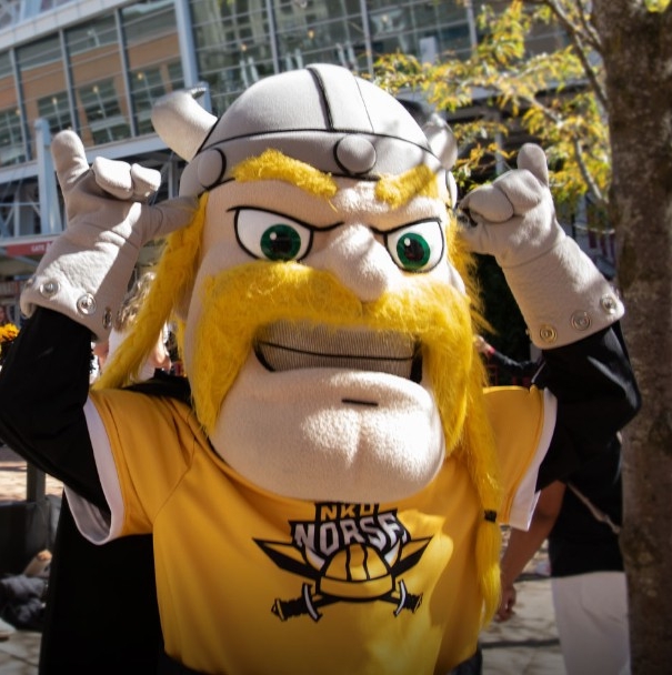 Victor E. Viking giving a "norse up" at event.