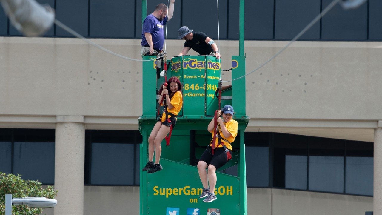 Students attending Victorfest and doing the zipline