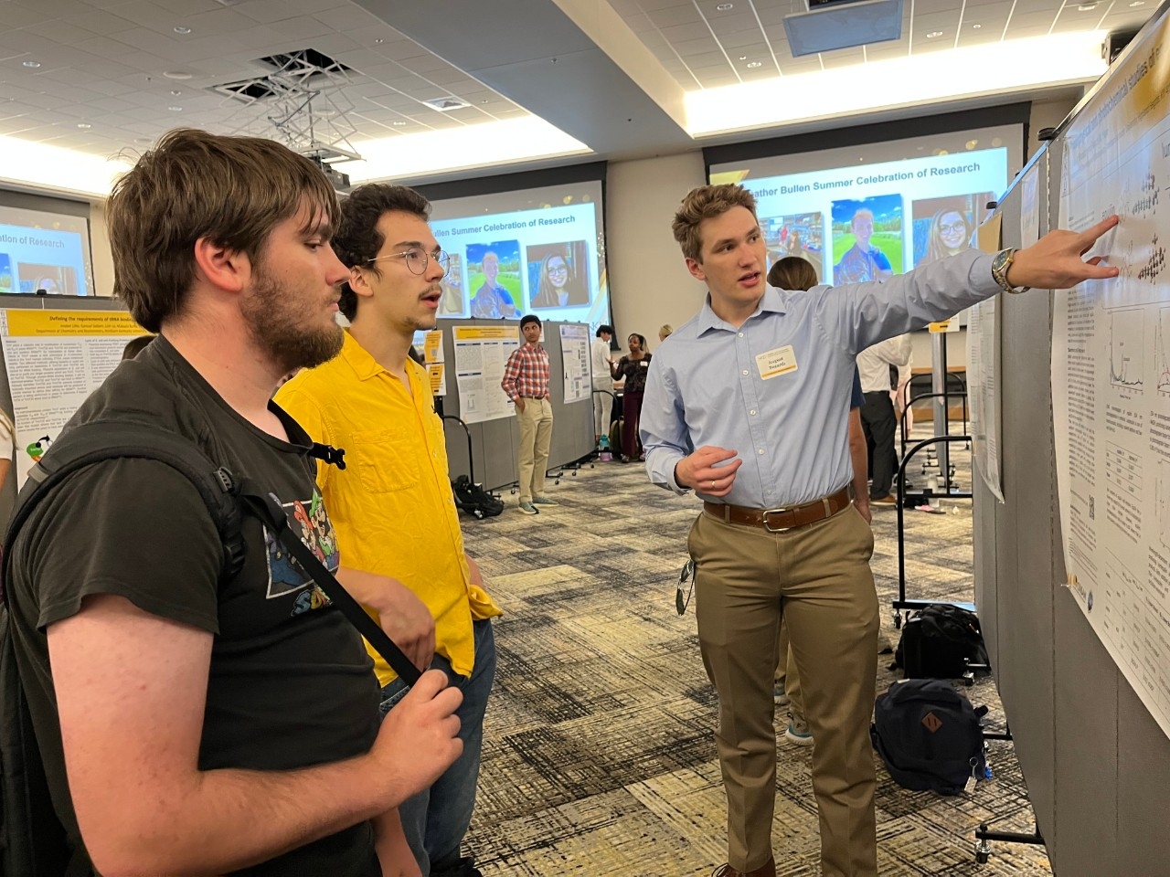 NKU student presents research poster to fellow students